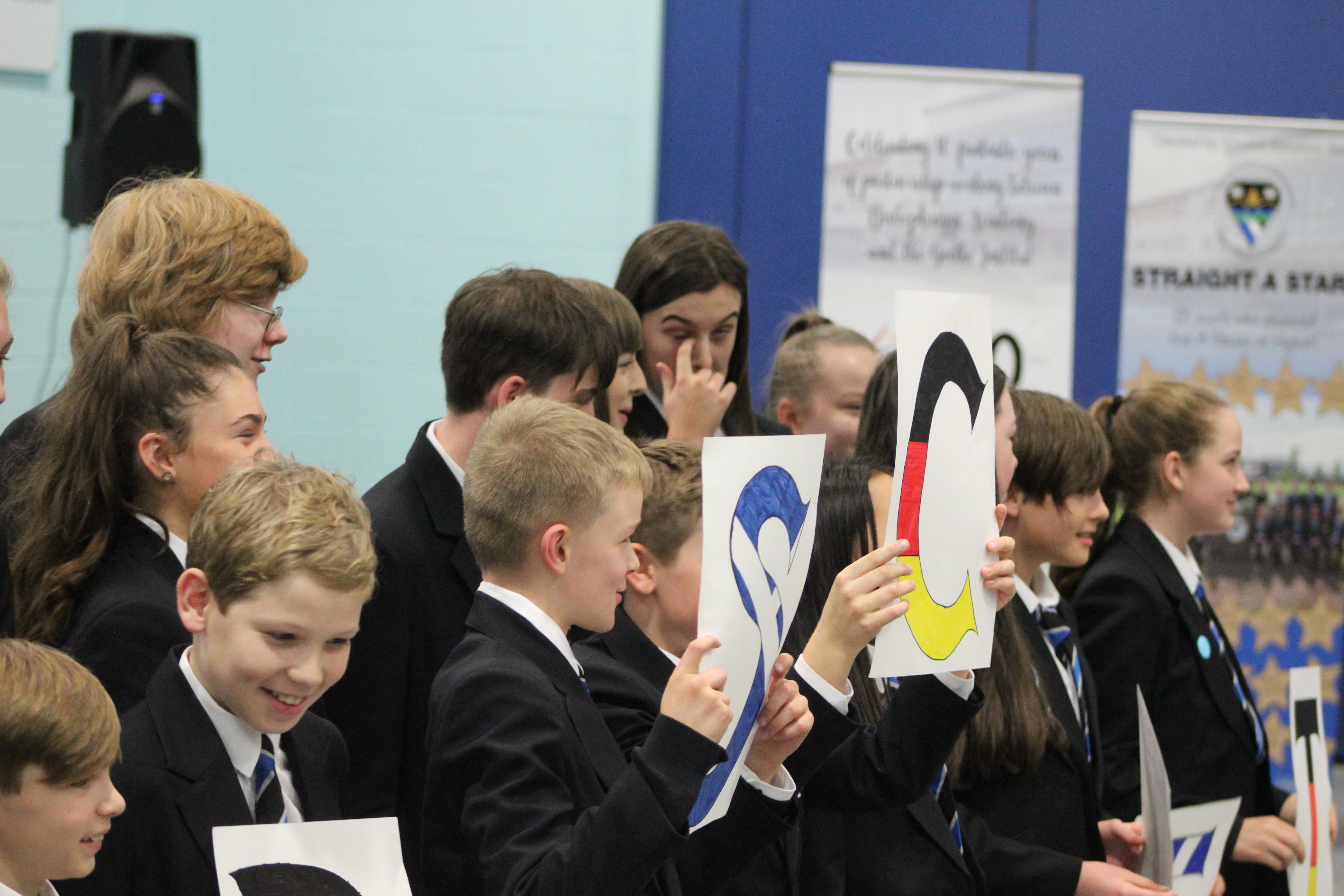 image o students holding paper